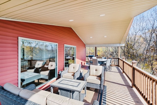 wooden deck with outdoor lounge area and outdoor dining area