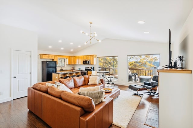 living area with lofted ceiling, dark wood-style floors, recessed lighting, baseboards, and a chandelier