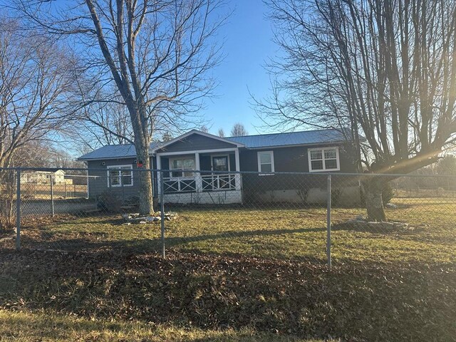 view of front of home with a fenced front yard and a front yard