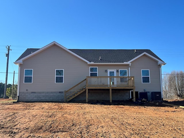 back of property with a shingled roof, crawl space, stairway, and a wooden deck