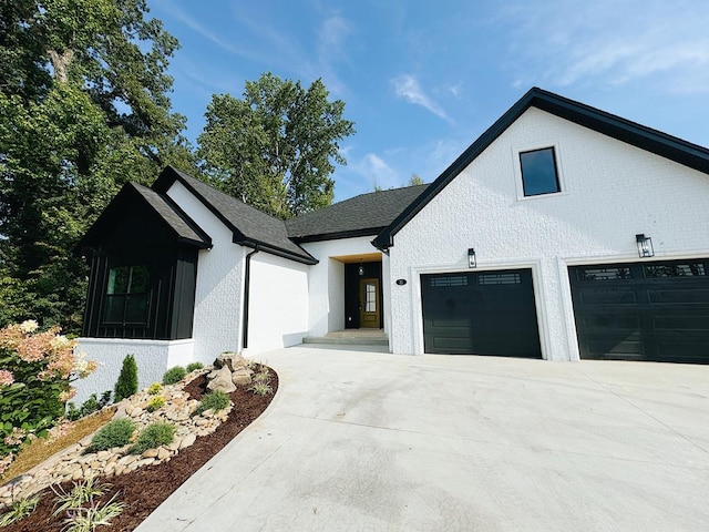 modern inspired farmhouse with driveway