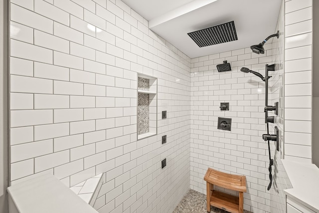 bathroom with a tile shower