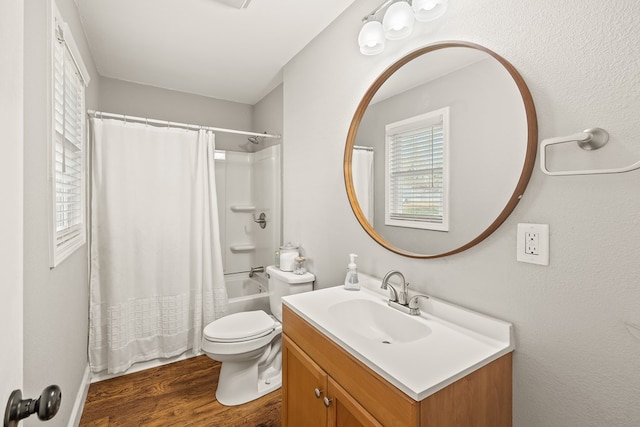 bathroom with toilet, shower / bath combo, wood finished floors, and vanity