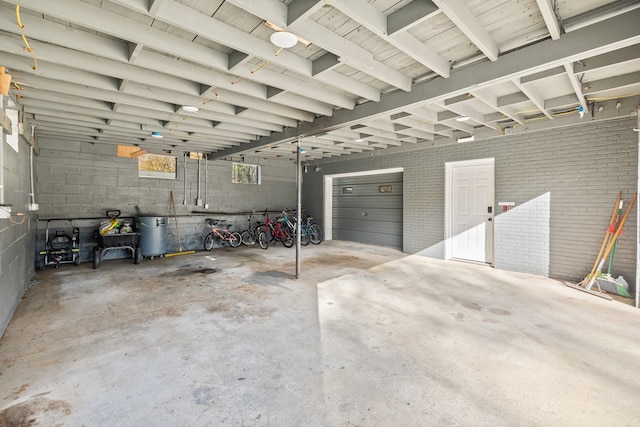 garage with concrete block wall