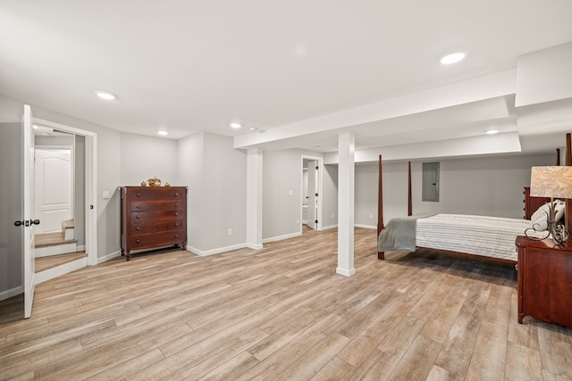 bedroom with light wood-style floors, recessed lighting, electric panel, and baseboards