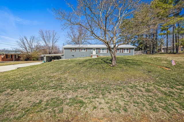 ranch-style house with concrete driveway and a front lawn