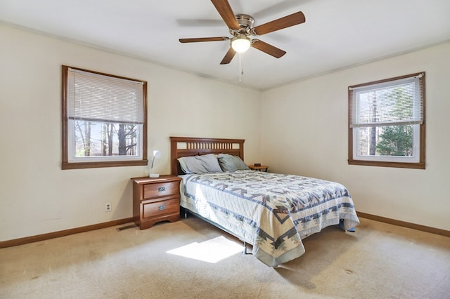 bedroom with a ceiling fan, visible vents, baseboards, and carpet flooring