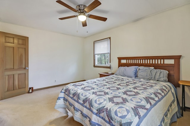 bedroom with light carpet, ceiling fan, and baseboards