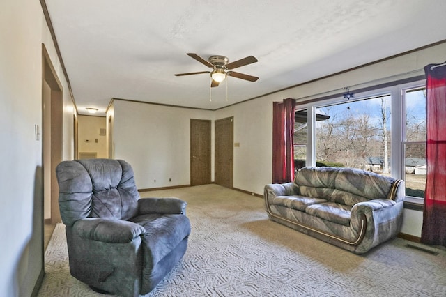 living area with baseboards, visible vents, light colored carpet, ceiling fan, and a textured ceiling