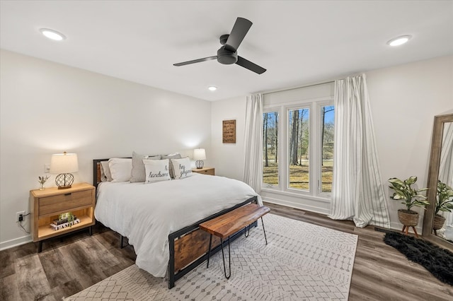 bedroom featuring baseboards, dark wood-style flooring, a ceiling fan, and recessed lighting