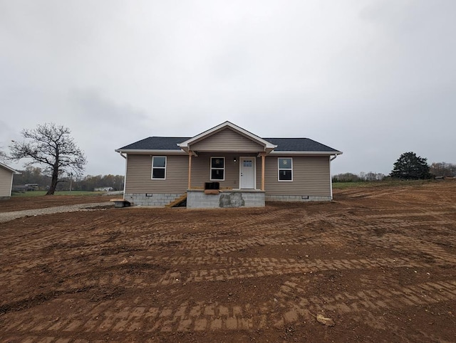 view of front of property with central AC and crawl space