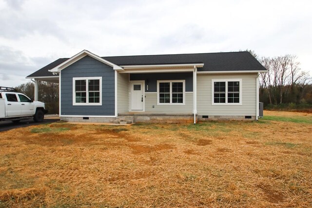 view of front of home featuring a porch, crawl space, and a front yard