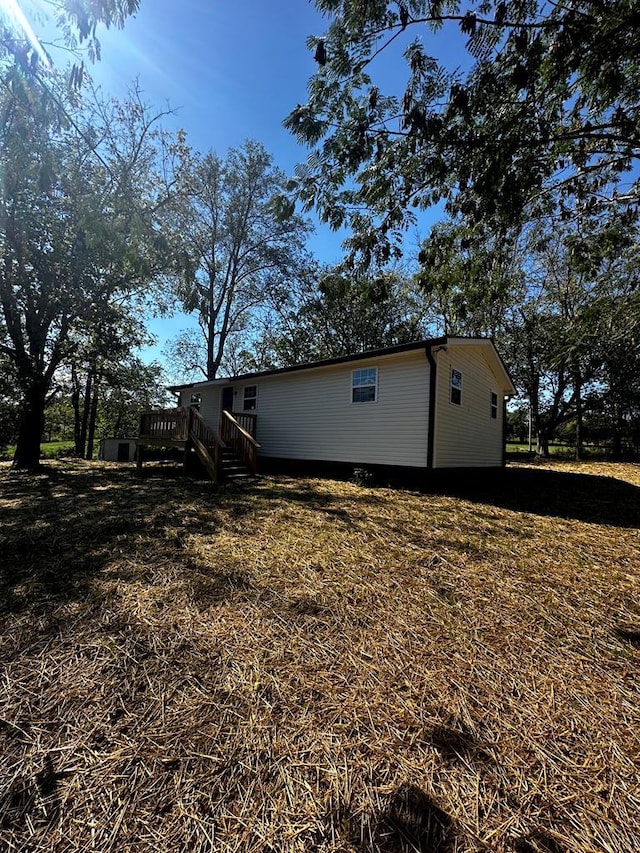 exterior space with a yard and a deck