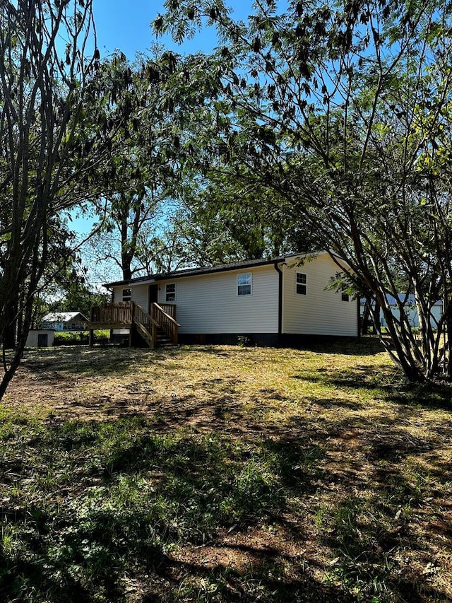 view of yard featuring a wooden deck