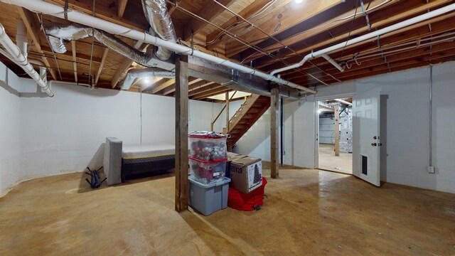 unfinished basement with stairs