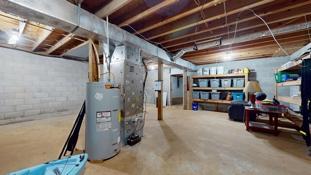 unfinished basement featuring electric water heater