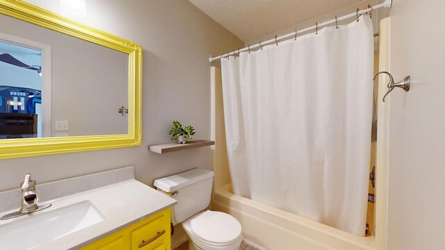 full bathroom with toilet, a textured ceiling, vanity, and shower / tub combo with curtain