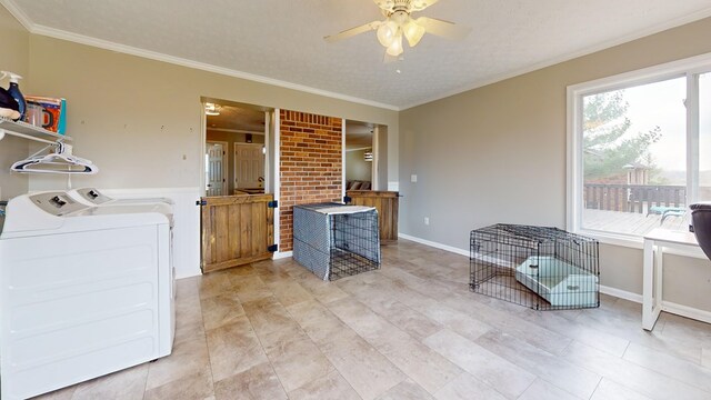 laundry area with ceiling fan, a textured ceiling, washing machine and dryer, and crown molding