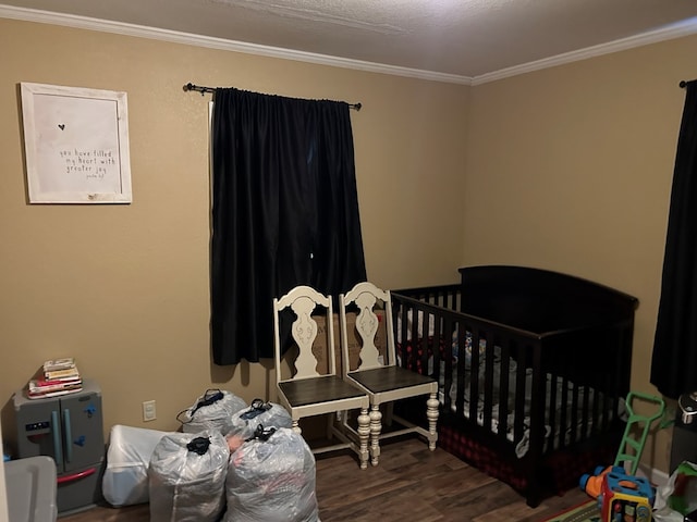 bedroom featuring dark wood finished floors and crown molding