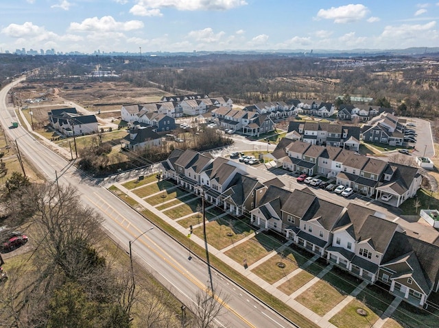 birds eye view of property with a residential view