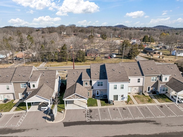 birds eye view of property with a residential view and a mountain view