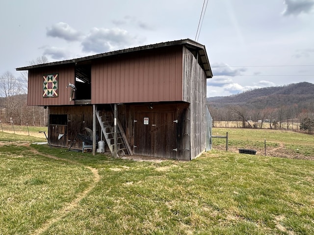 view of outbuilding with a mountain view and an outdoor structure