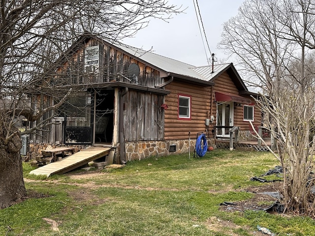 exterior space featuring a front yard and crawl space