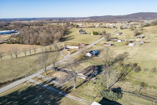 birds eye view of property with a rural view