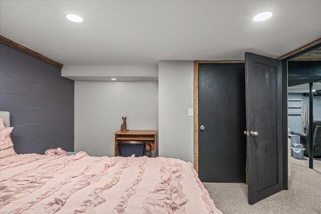 carpeted bedroom with recessed lighting