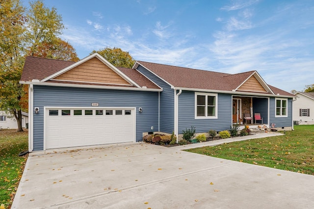 single story home with a garage, a shingled roof, concrete driveway, a porch, and a front yard