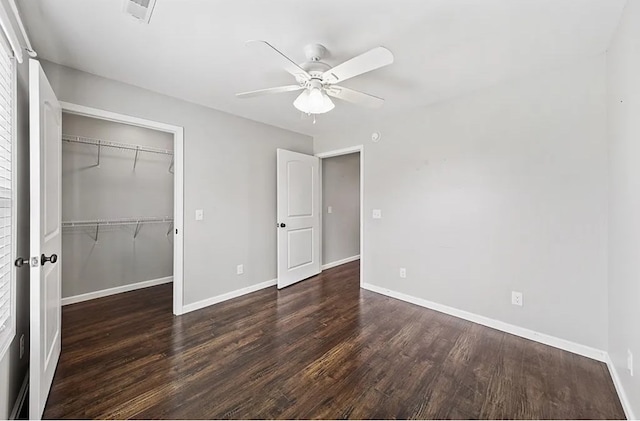 unfurnished bedroom with visible vents, baseboards, ceiling fan, dark wood-style flooring, and a closet