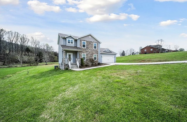 view of front of property featuring stone siding, an attached garage, driveway, and a front lawn