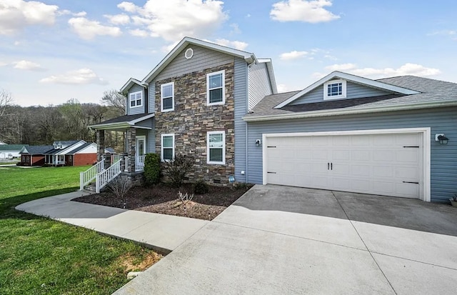 traditional home with an attached garage, covered porch, stone siding, concrete driveway, and a front lawn