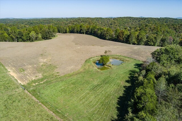 bird's eye view with a rural view and a view of trees