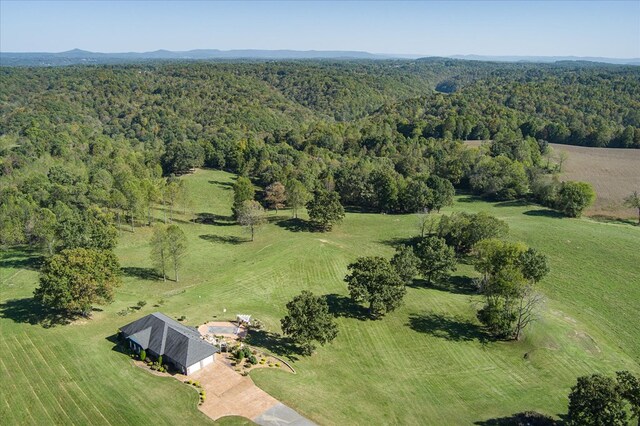 birds eye view of property featuring a rural view and a forest view