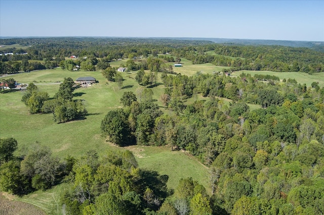 aerial view featuring a wooded view