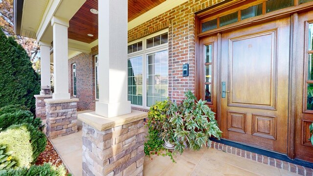 entrance to property with brick siding