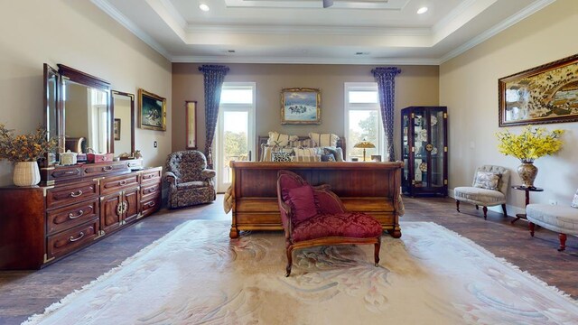 living area with crown molding, a raised ceiling, dark wood-style flooring, and recessed lighting