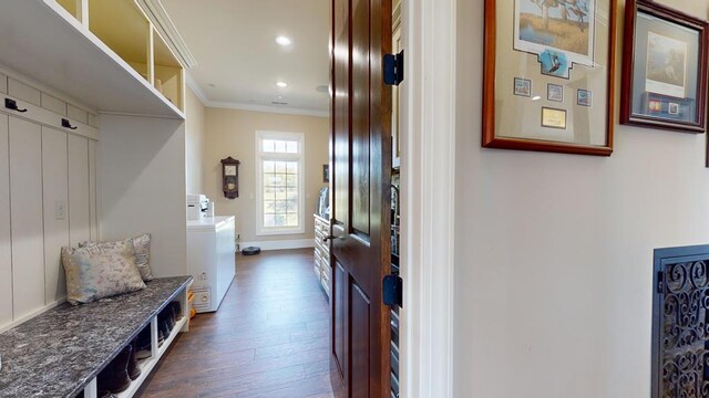 mudroom with baseboards, dark wood-style flooring, crown molding, separate washer and dryer, and recessed lighting