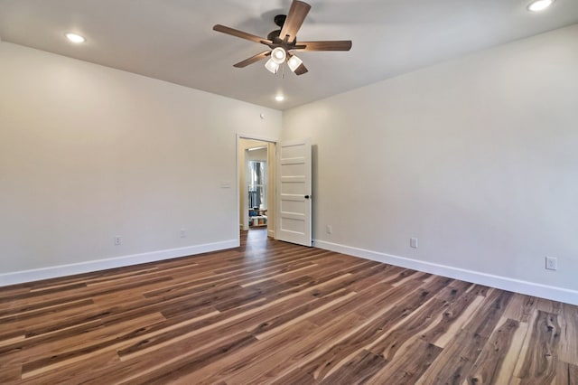 unfurnished room with dark wood-style floors, recessed lighting, a ceiling fan, and baseboards