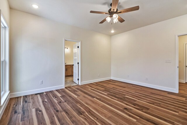 empty room with a ceiling fan, recessed lighting, baseboards, and wood finished floors