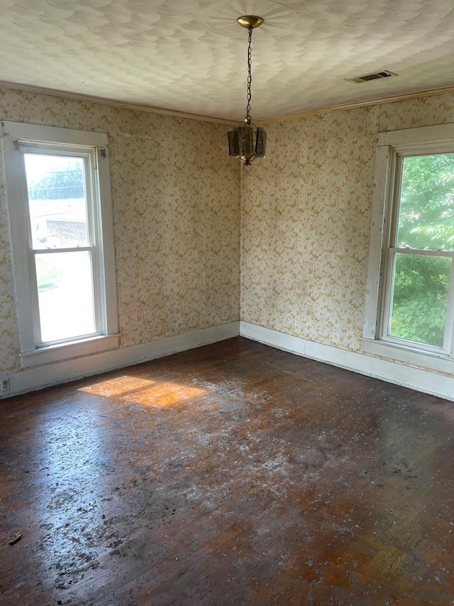 unfurnished room with baseboards, dark wood finished floors, and wallpapered walls