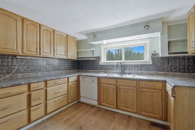 kitchen featuring a sink, light wood-type flooring, backsplash, dishwasher, and open shelves