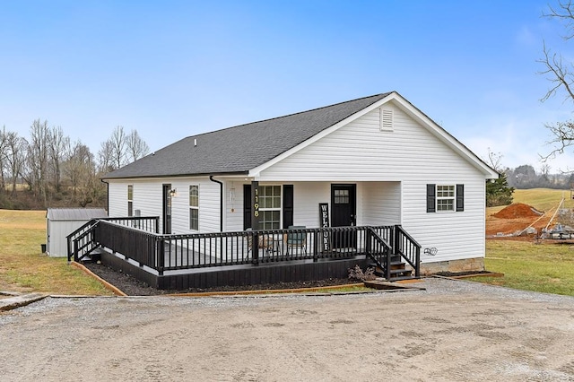 view of front of house featuring crawl space and a shingled roof