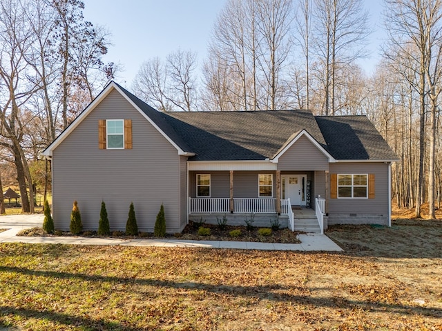 view of front of house with crawl space, covered porch, a shingled roof, and a front lawn