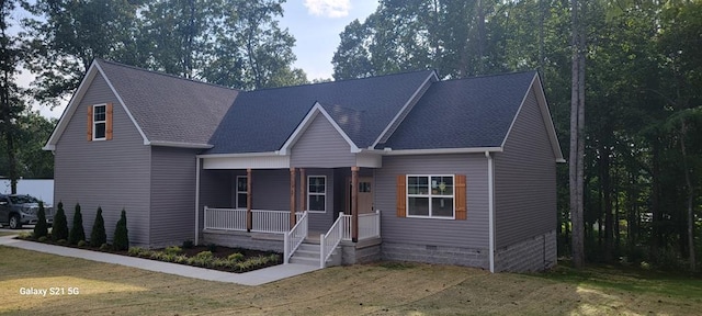 view of front of house with crawl space, a porch, and a front yard