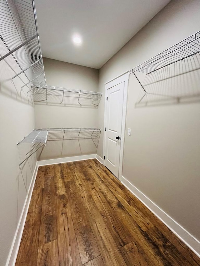 spacious closet with wood finished floors