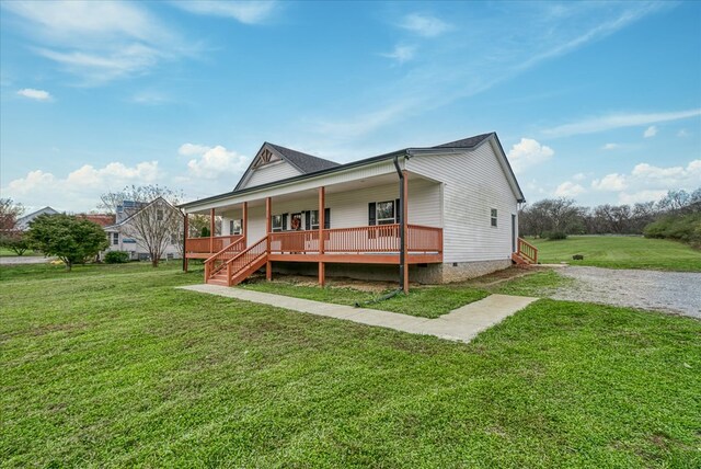 view of front of house featuring covered porch, driveway, a front lawn, and crawl space