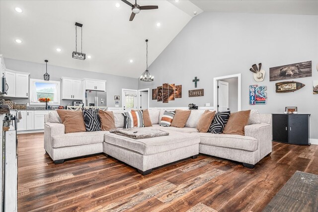 living area featuring dark wood-style floors, recessed lighting, ceiling fan, and high vaulted ceiling