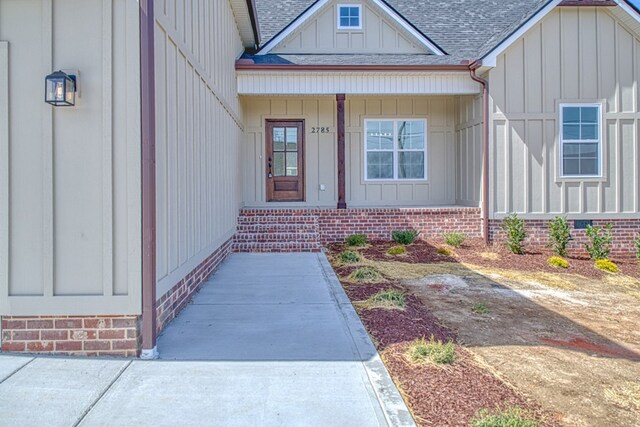 rear view of house featuring a shingled roof, crawl space, and a deck